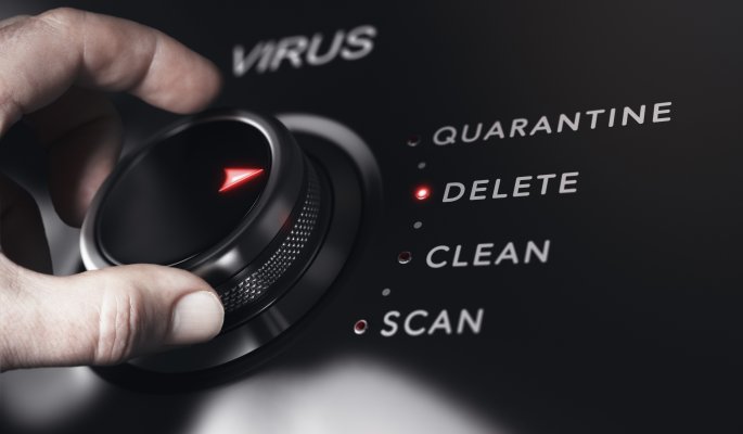 hand on rotating knob dial virus quarantine delete scan antivirus best small business